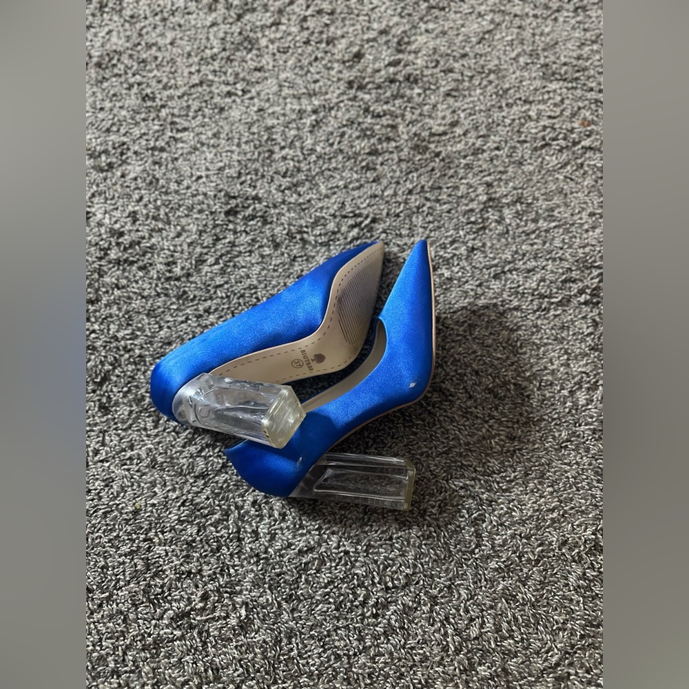 This is a blue high heels shoe I never wears it before it’s not so high
